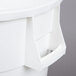 A white Continental Huskee 44 gallon round trash can with a handle.