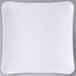 A white square Melamine plate with a spiral design.