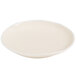An Arcoroc sand porcelain plate with a small rim.