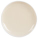 An Arcoroc white porcelain plate with a small white rim.