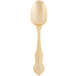 A gold plated stainless steel dinner spoon with a crown design on the handle.