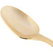 A 10 Strawberry Street Crown Royal stainless steel dinner spoon with a gold plated handle.