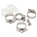 A set of stainless steel hose clamps and nuts on a white background.