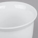 A close-up of a white Cambro porcelain bowl.