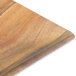 A Tablecraft melamine tray with a wood surface and brown handles.