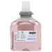 A bottle of pink GOJO Premium Foam Hand Soap with Skin Conditioners.