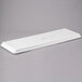 A white rectangular MFG Tray with a logo on it.