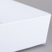 A close up of a white Tablecraft melamine rectangular bowl with a lid.