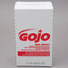 A white box of GOJO® Herbal Liquid Hand, Hair, and Body Wash with red text on a counter.