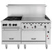 A large stainless steel Vulcan commercial gas range with 4 burners, a 36" thermostatic griddle, and 2 standard ovens.