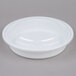 A white plastic 9" round microwavable container with a clear lid.