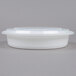 A 48 oz. white plastic round microwavable container with a lid.