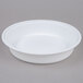 A white round plastic bowl with a lid.