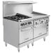 A large stainless steel Vulcan commercial range with two ovens and four burners.
