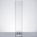 A clear acrylic infusion chamber on a clear plastic shelf.