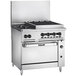 A large stainless steel Vulcan range with 2 burners and a charbroiler.