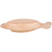 A TreeVive by EcoChoice fish-shaped palm leaf bowl on a table.