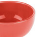 A close up of a Libbey Cantina porcelain bouillon bowl with a red surface.