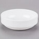 A Libbey Reflections white porcelain bowl on a gray surface.
