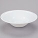 A Libbey Reflections white porcelain soup bowl with a small rim on a gray surface.