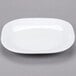 A white Libbey square porcelain plate with a small rim.