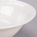 A Libbey ivory porcelain bowl with a white rim.
