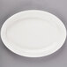 A white Libbey oval platter with a rim.