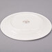 A white Libbey porcelain plate with brown writing on it.
