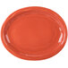 An orange oval Libbey porcelain platter with a design on it.