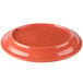 An orange Libbey Cantina porcelain oval platter with a carved design.