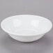 A Libbey white porcelain cereal bowl with a small rim on a gray surface.
