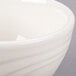 A Libbey ivory porcelain bowl with a wavy design.