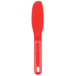 A red plastic sandwich spreader with a round ball on the end.
