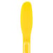 A yellow plastic sandwich spreader with a handle.