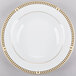 A white Syracuse China bone china soup bowl with gold trim.