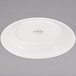 A white Libbey porcelain plate with a medium rim.