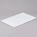 A white rectangular GET melamine adapter plate cover on a gray surface.