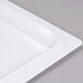 A white GET Melamine adapter plate with a handle.