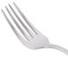 A Libbey stainless steel dessert fork with four tines.