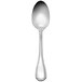 A silver spoon with a black and white handle.