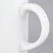 A close-up of a 10 Strawberry Street Royal White porcelain coffee mug with a C-handle.