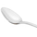 A Libbey stainless steel iced tea spoon with a white handle.
