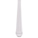 A close up of a Libbey stainless steel dessert fork with a white background.