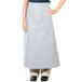 A woman wearing a gray Intedge bistro apron with 2 pockets.