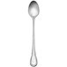 A silver iced tea spoon with a baroque handle.