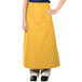 A woman wearing a gold Intedge bistro apron with pockets.