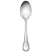 A silver demitasse spoon with a Baroque handle.