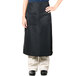 A person wearing a black Intedge bistro apron with two pockets.