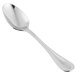 A close-up of a Libbey stainless steel teaspoon with a white background.