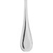 A close-up of a Libbey stainless steel teaspoon with a long handle.